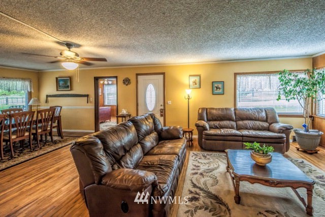 9590 Smith Springs Road Prescott, WA 99348 - Photo 4 of 40 a living room with furniture and wooden floor