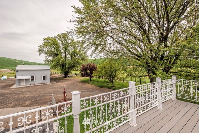 9590 Smith Springs Road Prescott, WA 99348 - Photo 6 of 40 a view of a house with wooden deck