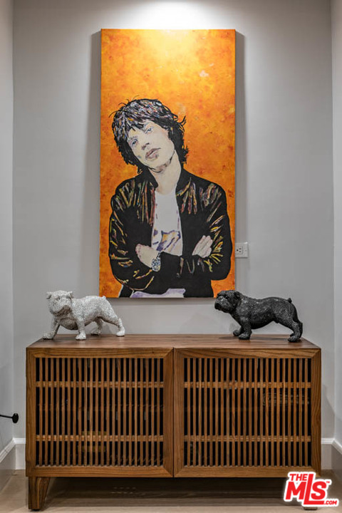 23910 De Way, Unit C Malibu, CA 90265 - Photo 11 of 45 a bedroom with a bed and wooden floor