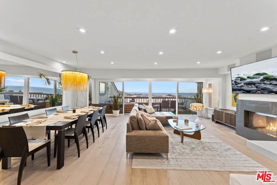 23910 De Way, Unit C Malibu, CA 90265 - Photo 12 of 45 a living room with lots of furniture and a fireplace