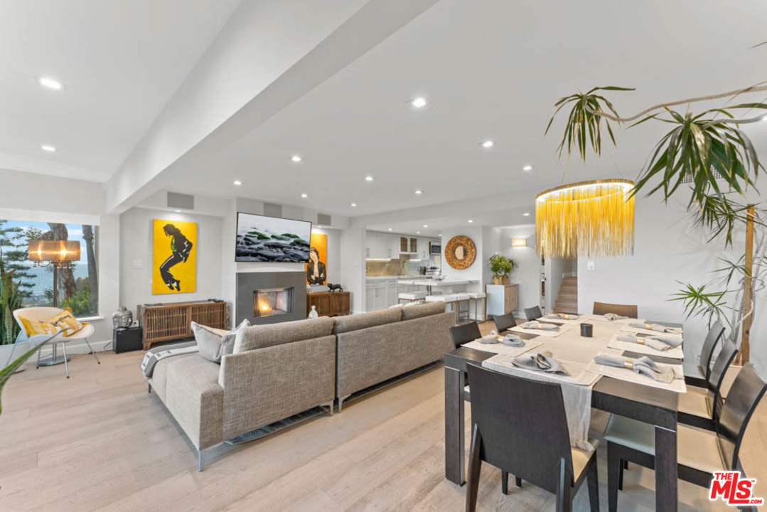 23910 De Way, Unit C Malibu, CA 90265 - Photo 13 of 45 a living room with furniture kitchen view and a table