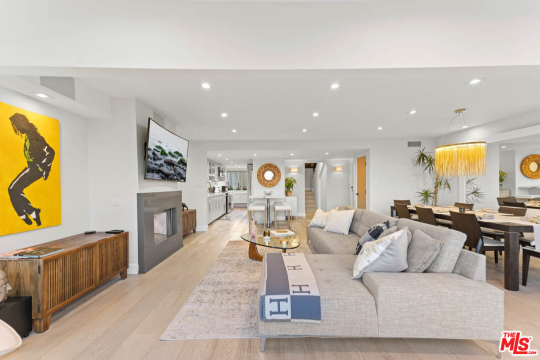 23910 De Way, Unit C Malibu, CA 90265 - Photo 16 of 45 a living room with fireplace furniture and a flat screen tv
