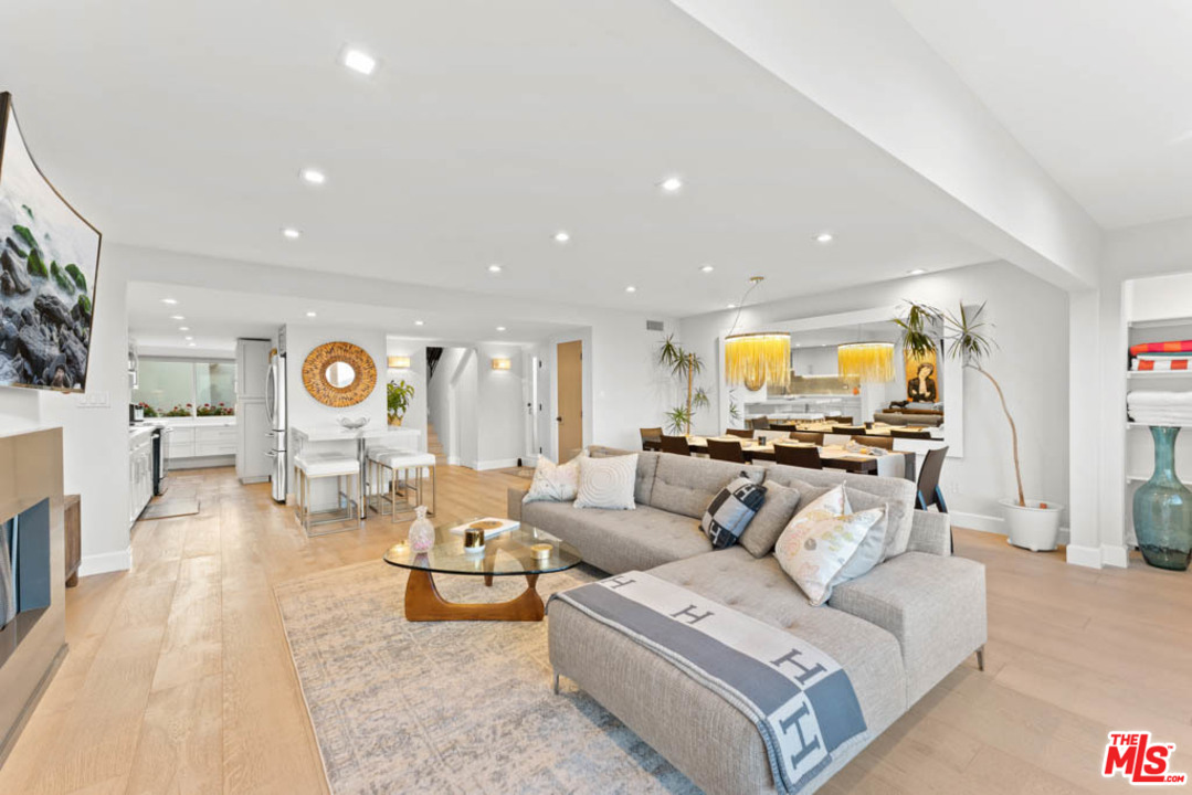 23910 De Way, Unit C Malibu, CA 90265 - Photo 17 of 45 a living room with furniture and a flat screen tv