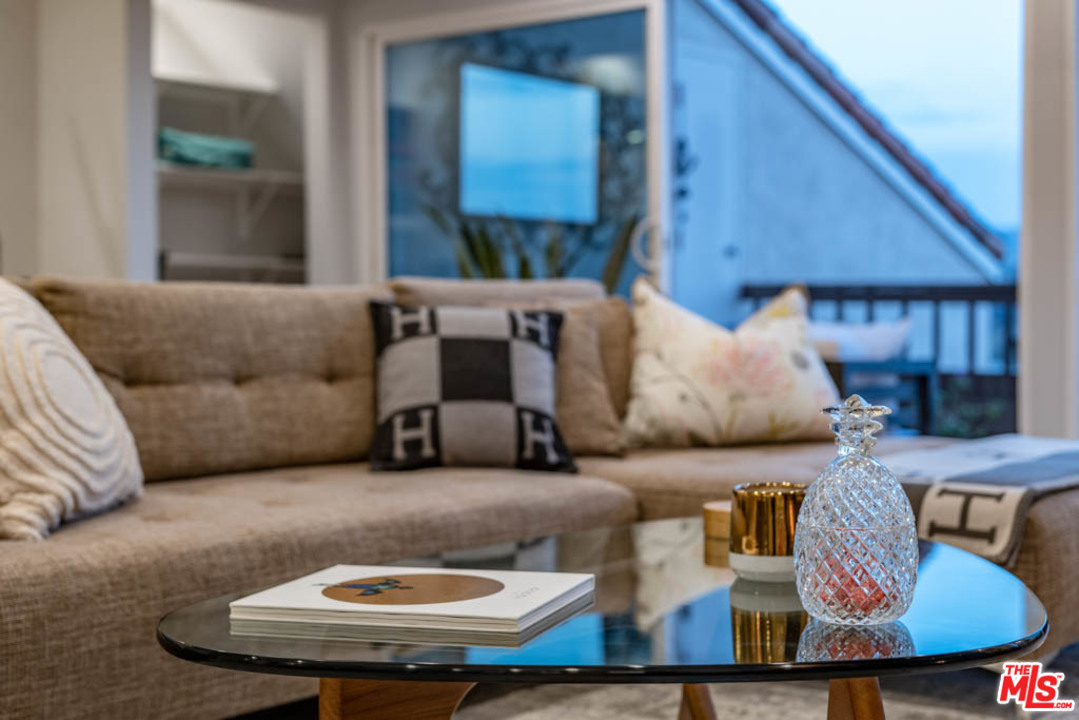 23910 De Way, Unit C Malibu, CA 90265 - Photo 18 of 45 a living room with furniture and a wooden floor