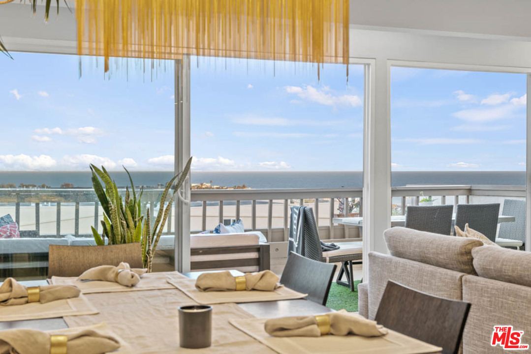 23910 De Way, Unit C Malibu, CA 90265 - Photo 24 of 45 a living room with furniture and a large window