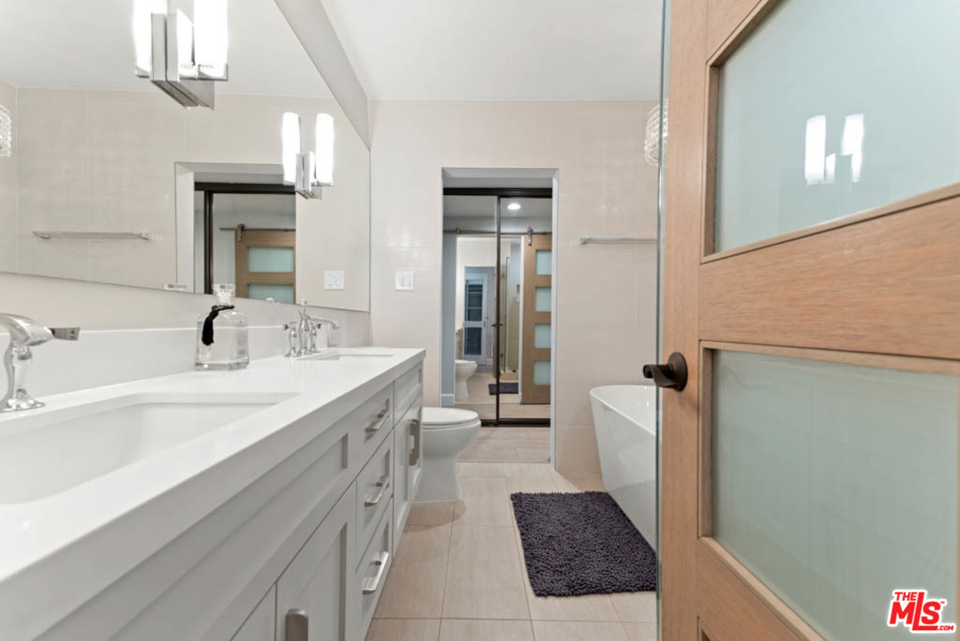 23910 De Way, Unit C Malibu, CA 90265 - Photo 28 of 45 a spacious bathroom with a tub sink and mirror