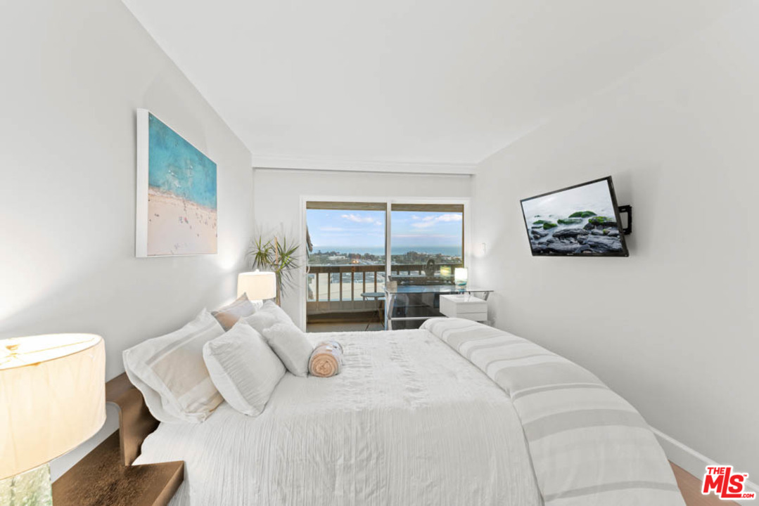 23910 De Way, Unit C Malibu, CA 90265 - Photo 37 of 45 a large bedroom with a bed and a large window