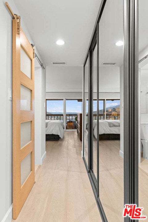 23910 De Way, Unit C Malibu, CA 90265 - Photo 42 of 45 a view of a hallway with living room and furniture