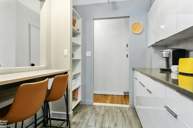 a kitchen with stainless steel appliances granite countertop a sink and cabinets