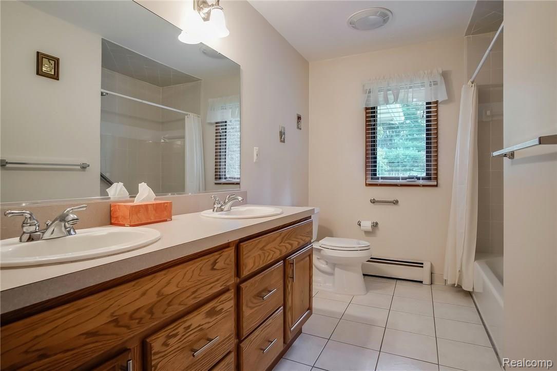 25464 Johns Road South Lyon, MI 48178 - Photo 17 of 23 main bath with dual sinks