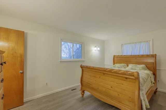 a bathroom with a sink a mirror and shower