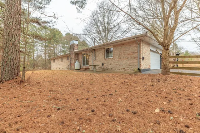 a backyard of a house with lots of green space