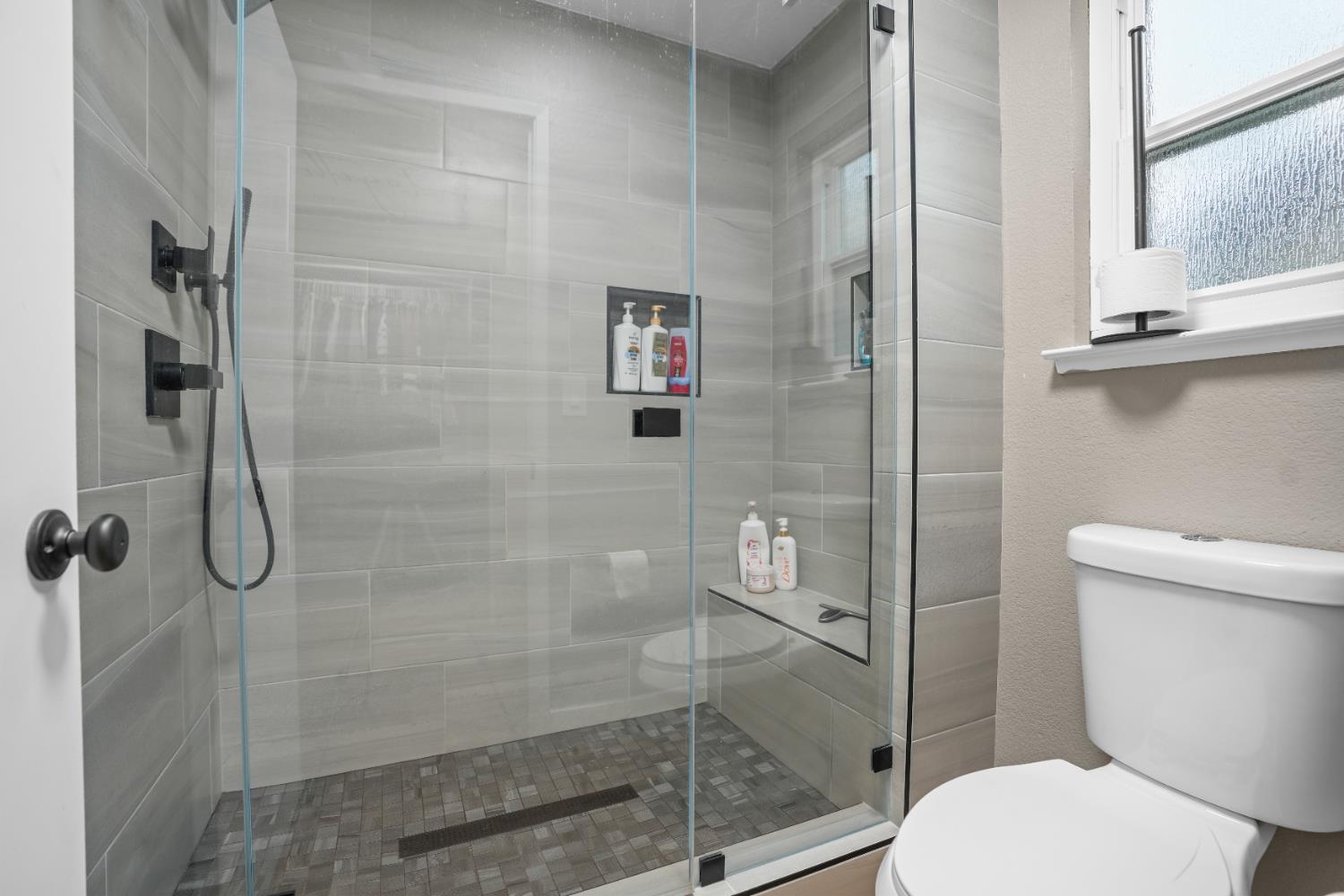 5125 Amaro Way Salida, CA 95368 - Photo 20 of 37 a bathroom with a toilet and a shower