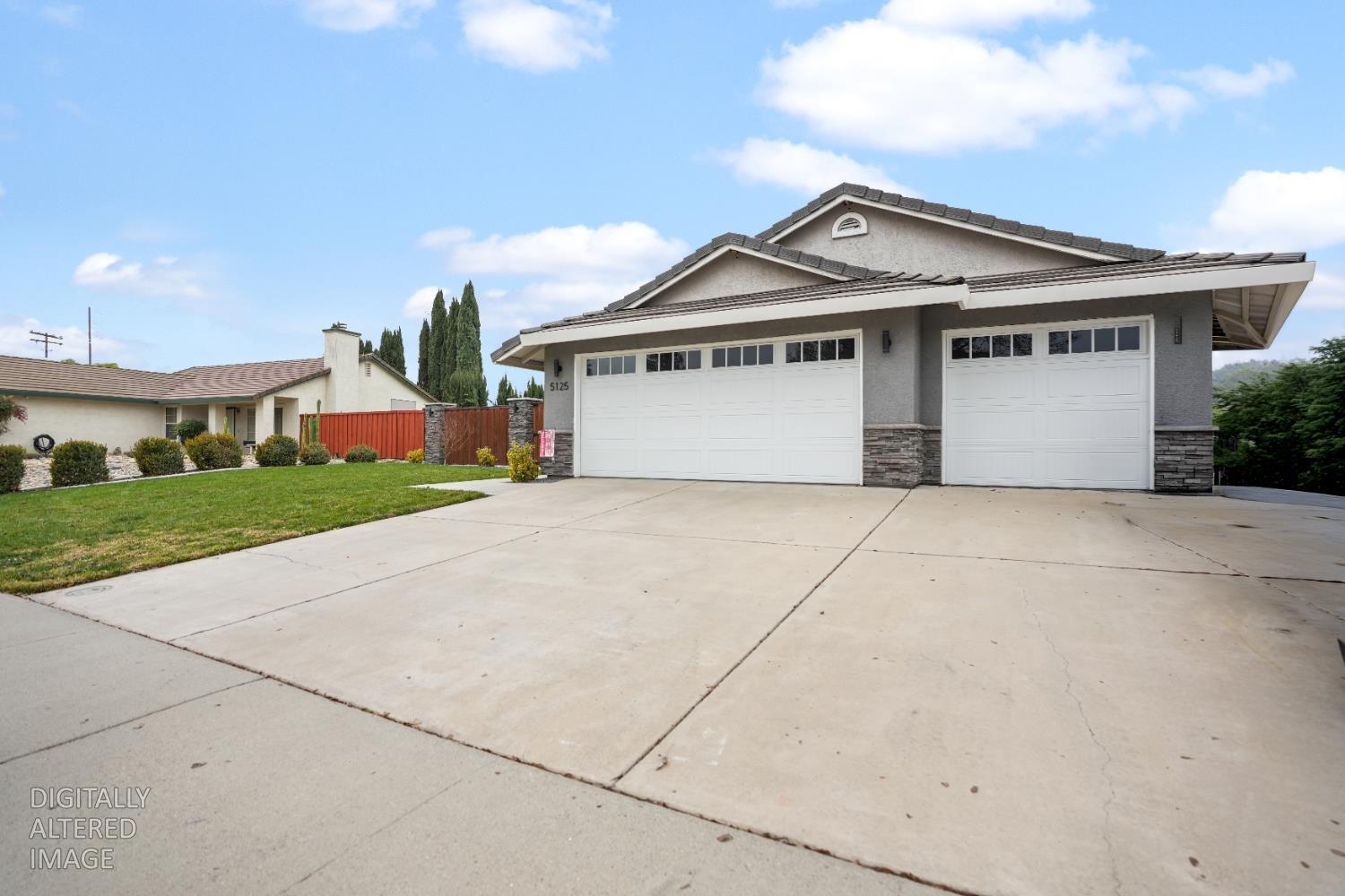 5125 Amaro Way Salida, CA 95368 - Photo 3 of 37 a front view of house with yard