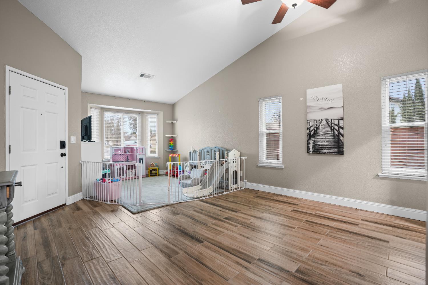 5125 Amaro Way Salida, CA 95368 - Photo 6 of 37 a view of a livingroom with workspace and a window