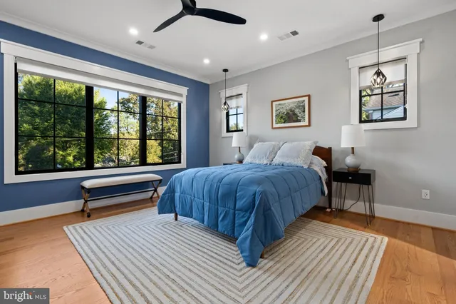 a spacious bedroom with a large bed and a window