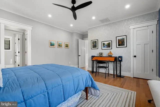 a bedroom with a bed and a table in it