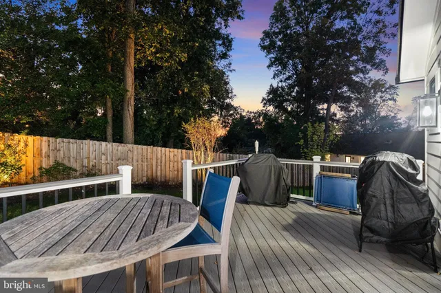 a view of balcony with wooden floor and outdoor seating