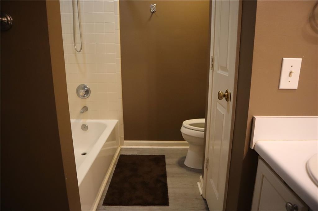1103 Garden Court Atlanta, GA 30328 - Photo 11 of 17 a bathroom with a sink and a toilet