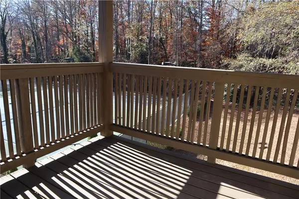 a view of balcony with wooden floor