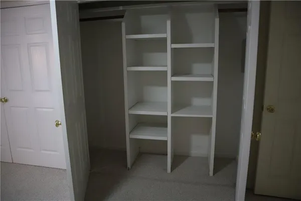 a view of an empty walk in closet