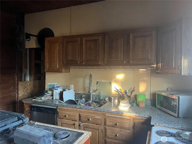 a kitchen with a sink and cabinets