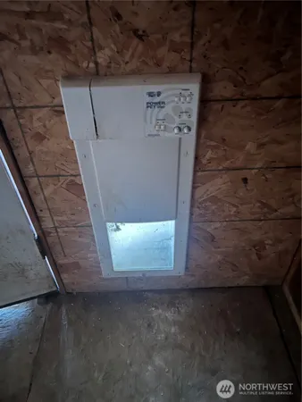 a view of electric room and utility room