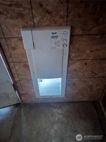 a view of electric room and utility room