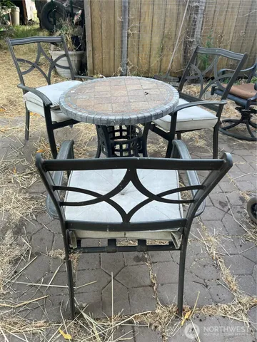 a table and chairs sitting on a roof