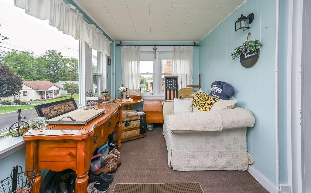 825 Childs Avenue Monaca, PA 15061 - Photo 12 of 35 a living room with furniture and a floor to ceiling window