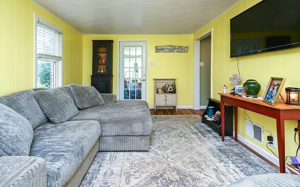825 Childs Avenue Monaca, PA 15061 - Photo 16 of 35 a living room with furniture flat screen tv and a window