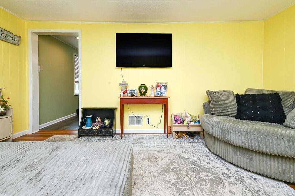 825 Childs Avenue Monaca, PA 15061 - Photo 17 of 35 a living room with furniture and a flat screen tv