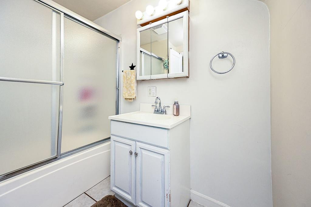 825 Childs Avenue Monaca, PA 15061 - Photo 34 of 35 a bathroom with a sink and a mirror