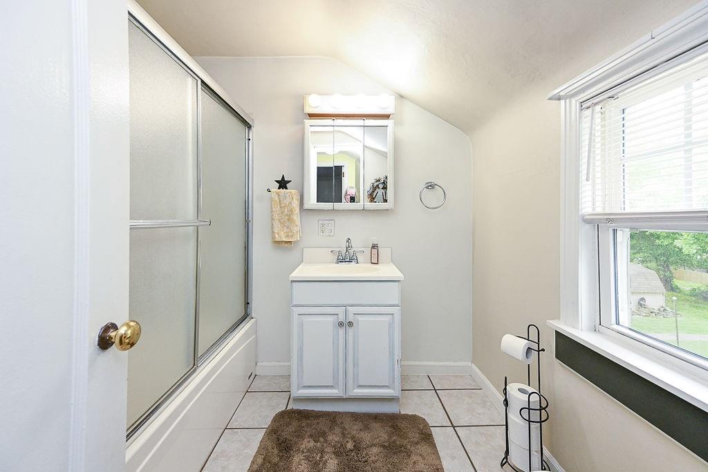 825 Childs Avenue Monaca, PA 15061 - Photo 35 of 35 a bathroom with a sink a mirror and a window
