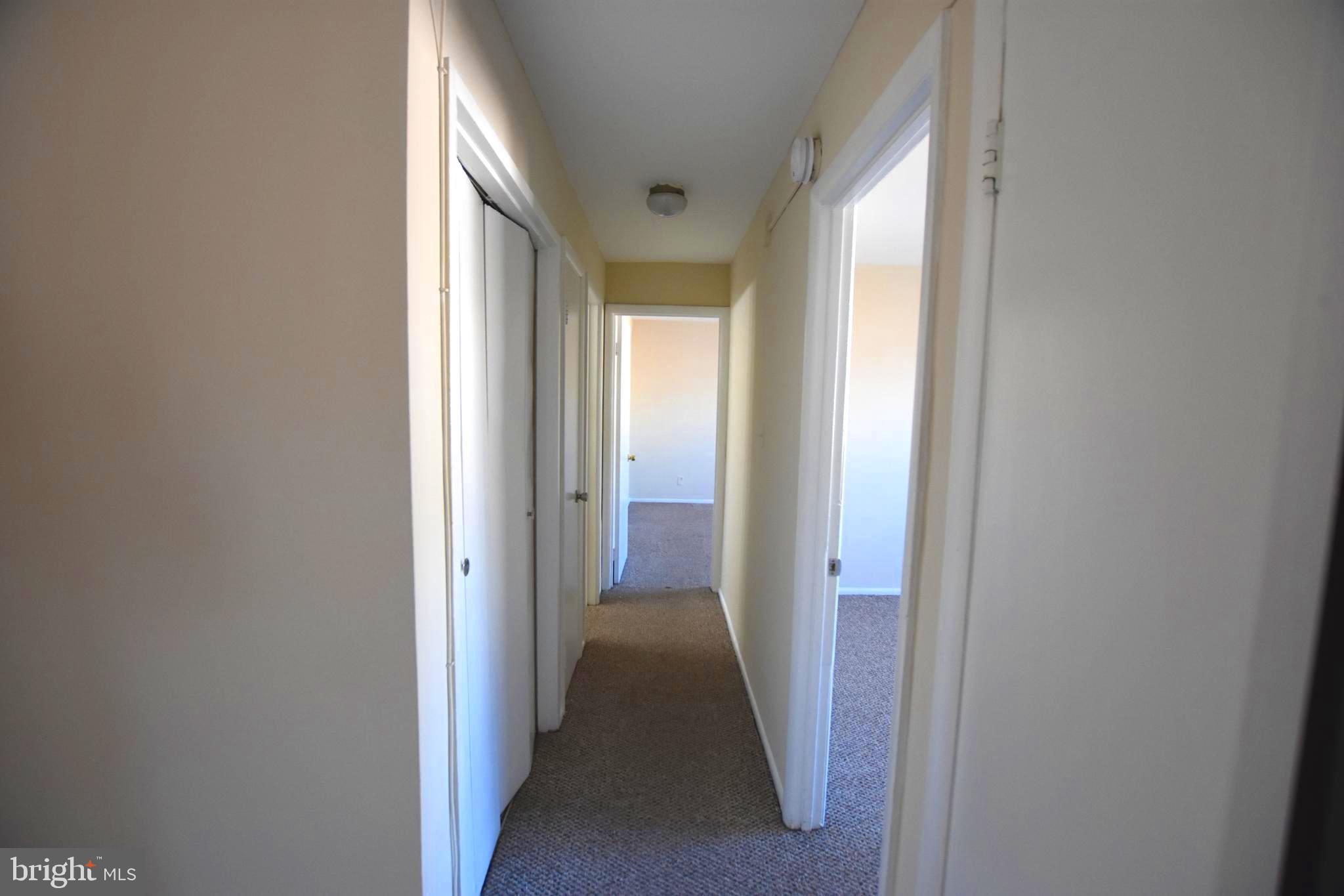 4313 Knox Road, Unit 501 College Park, MD 20740 - Photo 10 of 17 a view of a hallway with a wooden floor