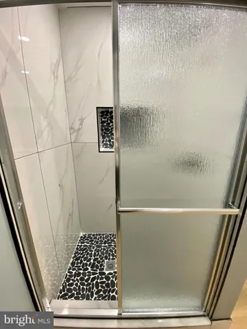 a bathroom with a sink a toilet and a window