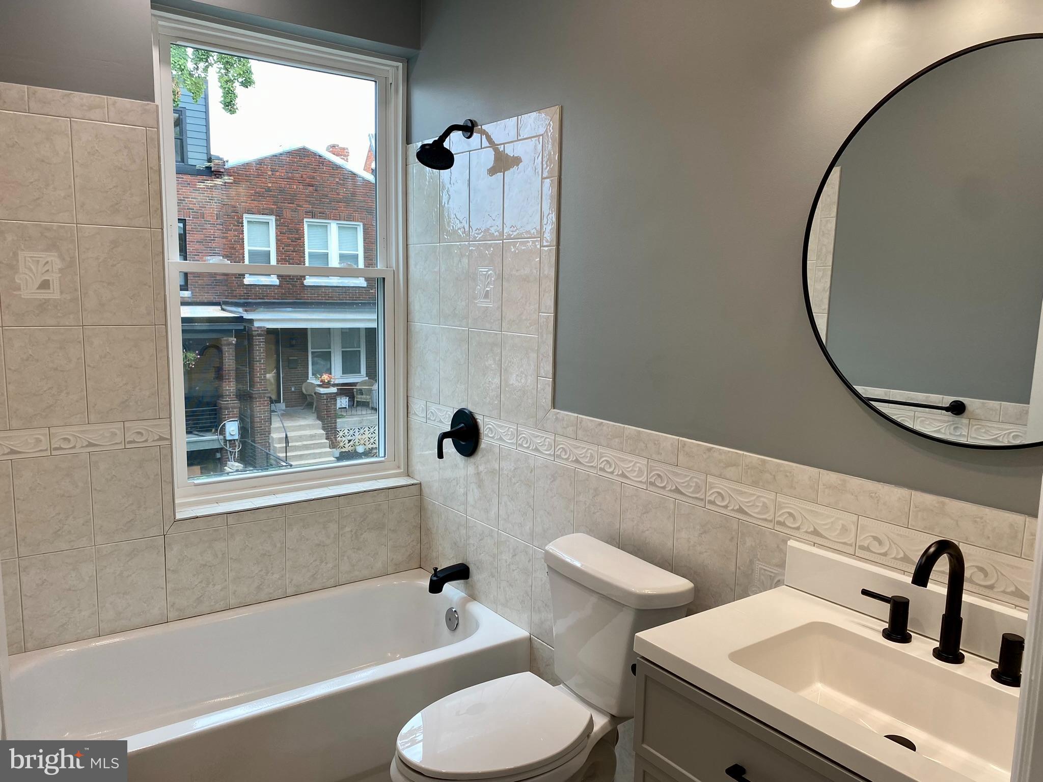 3701 9th Street Northwest, Unit 4 Washington, DC 20010 - Photo 17 of 19 a bathroom with a sink toilet and shower