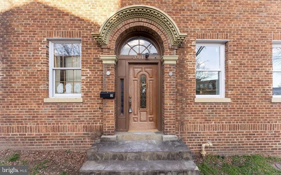 3701 9th Street Northwest, Unit 4 Washington, DC 20010 - Photo 18 of 19 a view of a brick house with large windows