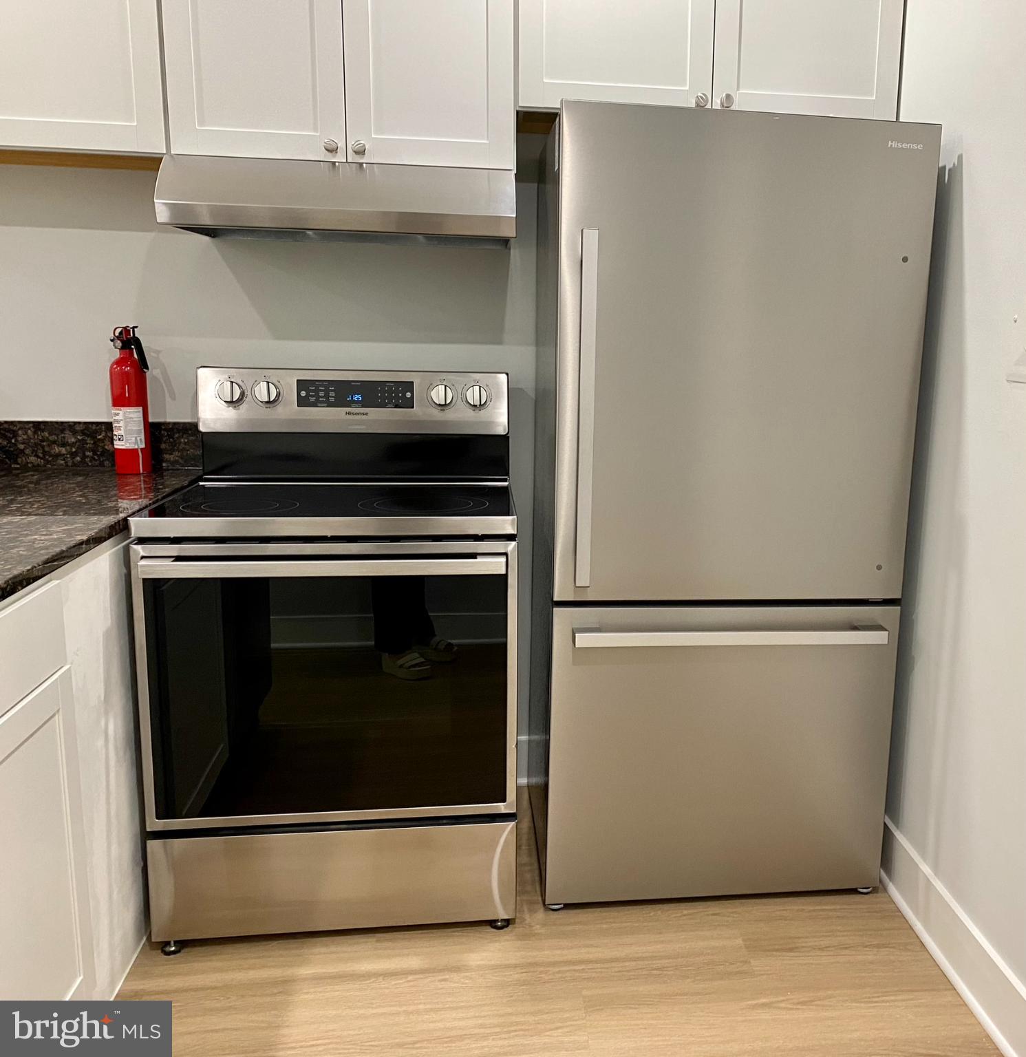 3701 9th Street Northwest, Unit 4 Washington, DC 20010 - Photo 4 of 19 a stove top oven sitting inside of a kitchen