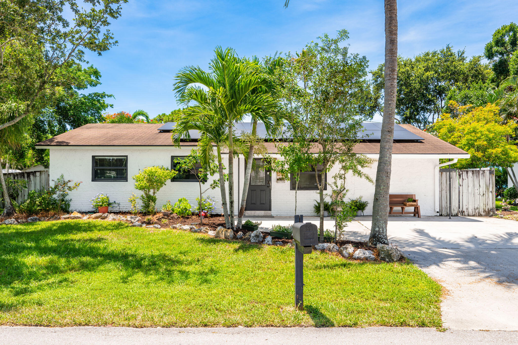 a front view of house with yard and outdoor seating