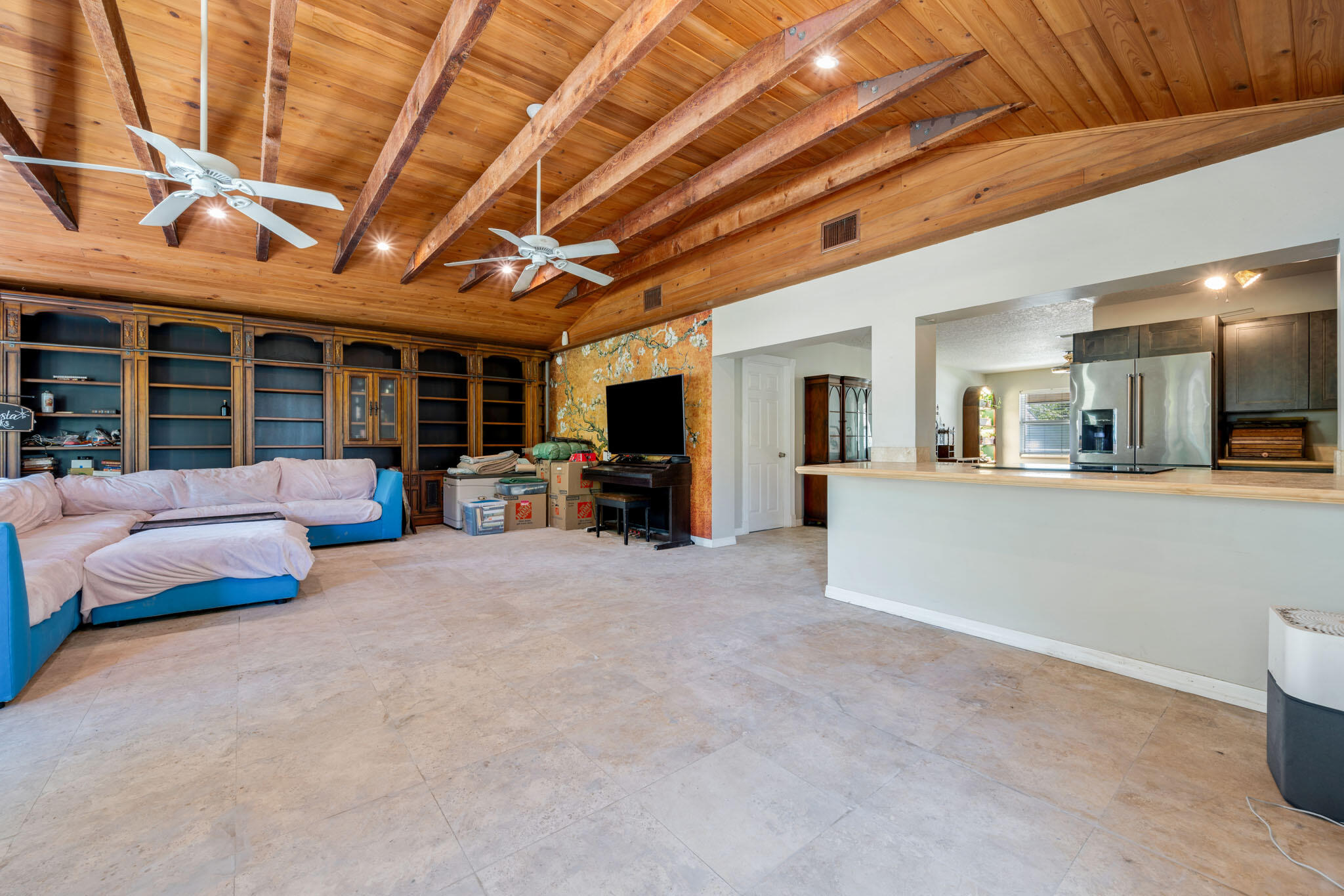 1216 Neoga Street Jupiter, FL 33458 - Photo 11 of 27 a living room with furniture and a large window