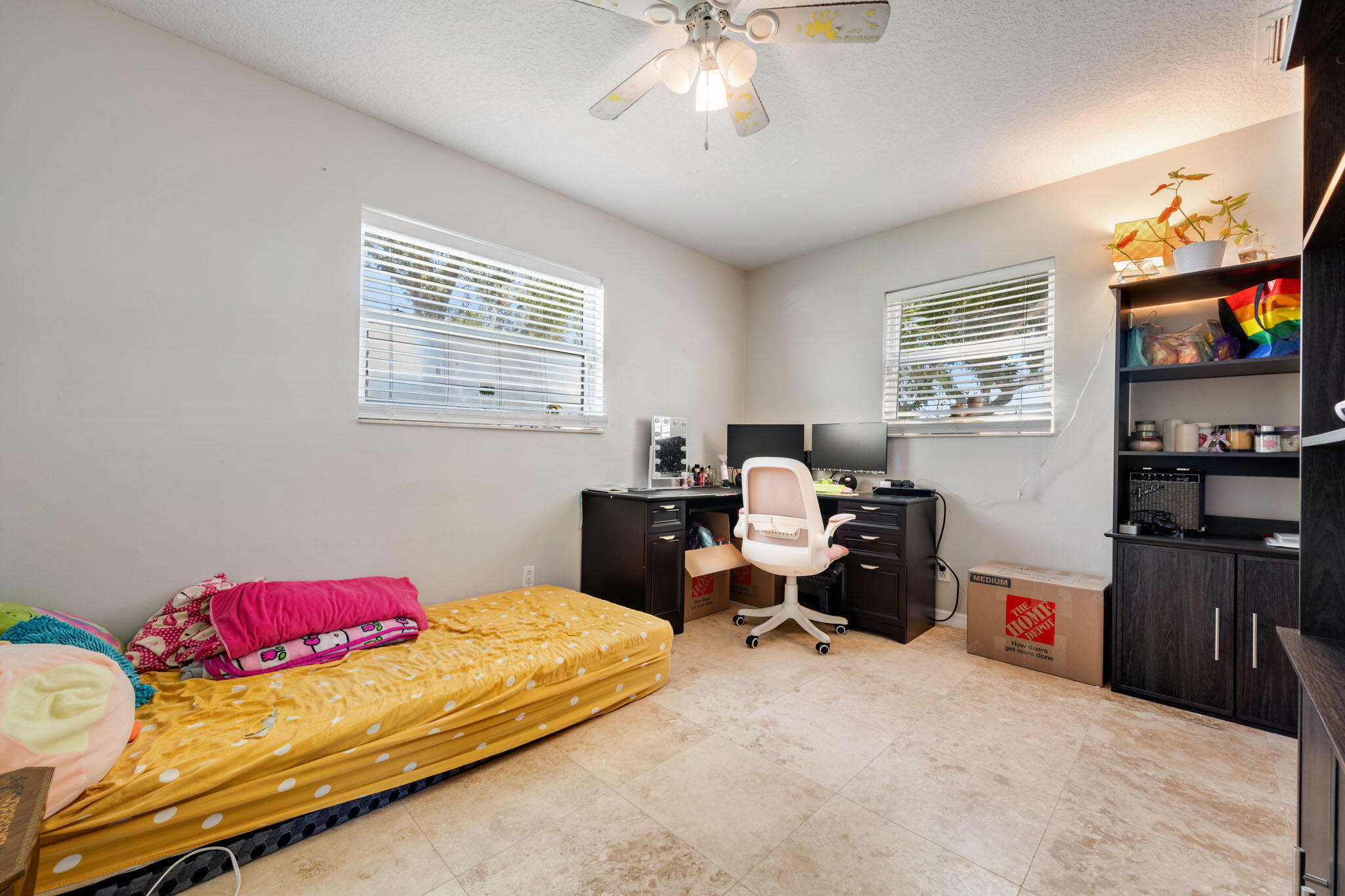 1216 Neoga Street Jupiter, FL 33458 - Photo 12 of 27 a bedroom with a bed and a chandelier