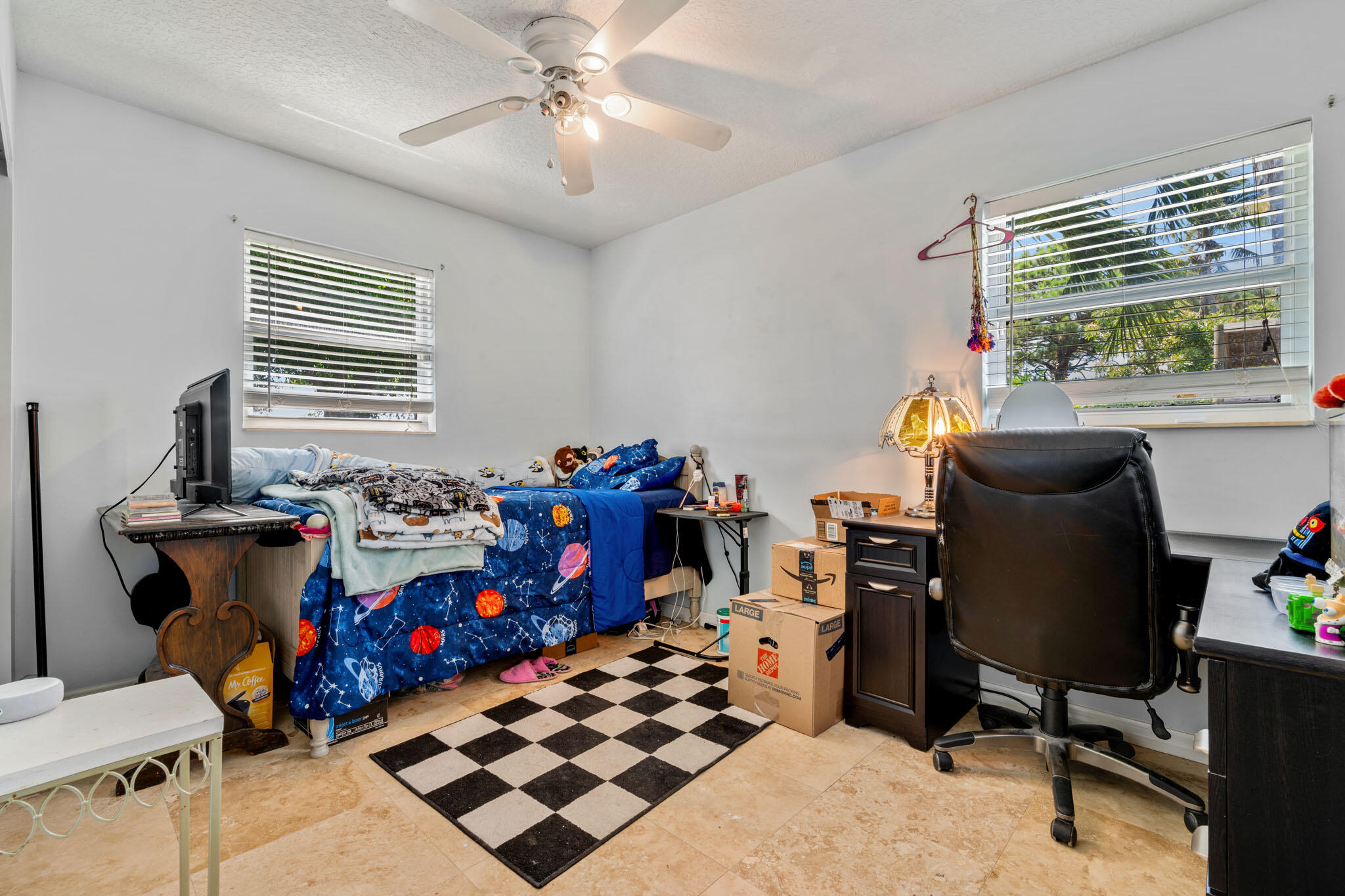 1216 Neoga Street Jupiter, FL 33458 - Photo 14 of 27 a bedroom with furniture and a window