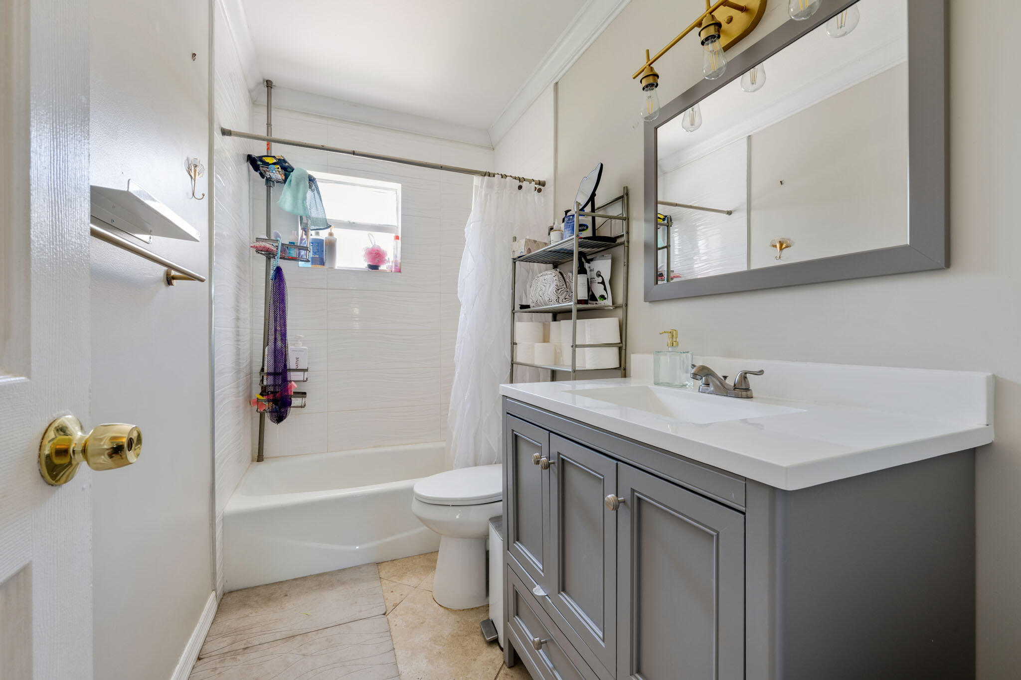 1216 Neoga Street Jupiter, FL 33458 - Photo 15 of 27 a bathroom with a sink a toilet and shower