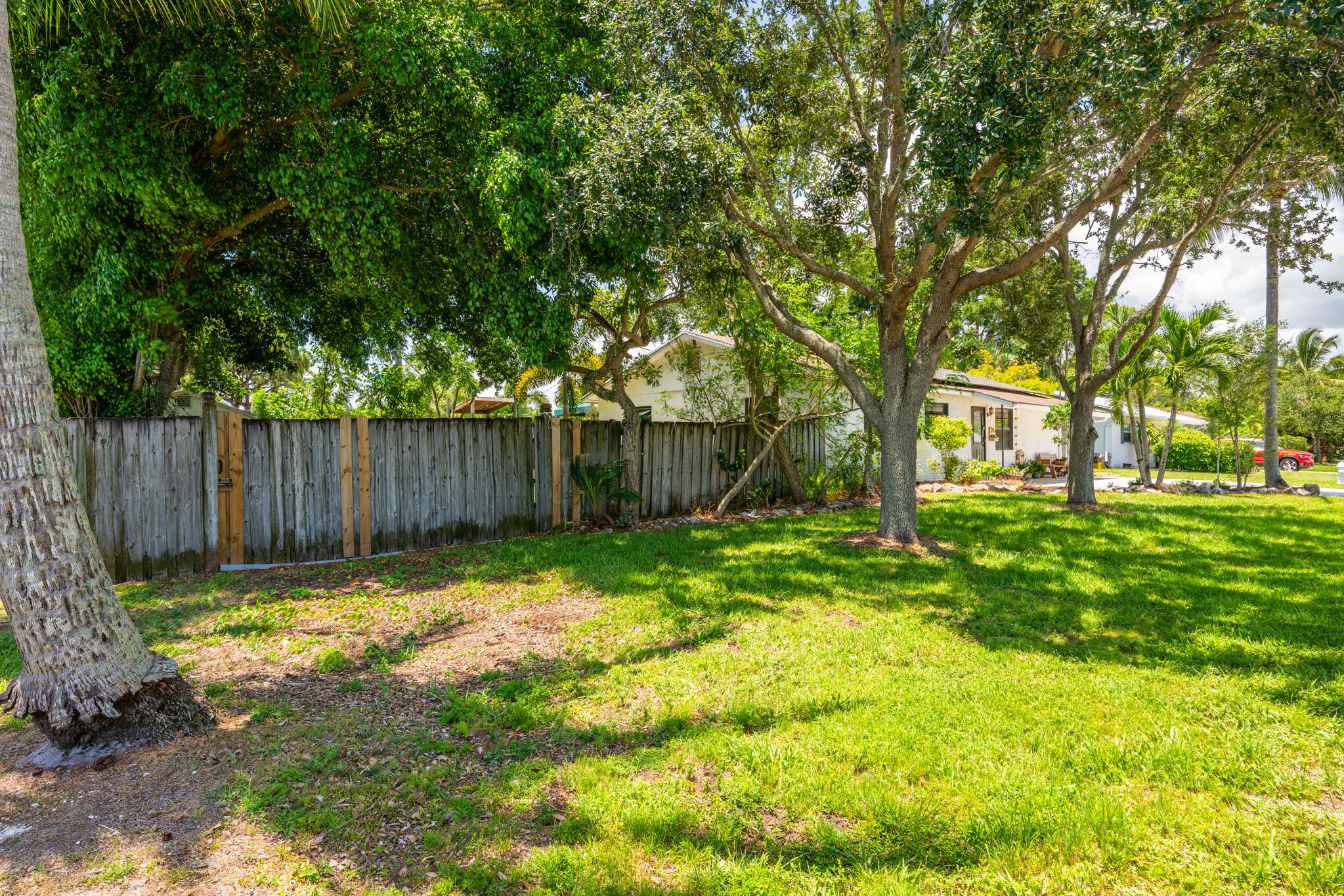 1216 Neoga Street Jupiter, FL 33458 - Photo 22 of 27 a view of a house with a yard