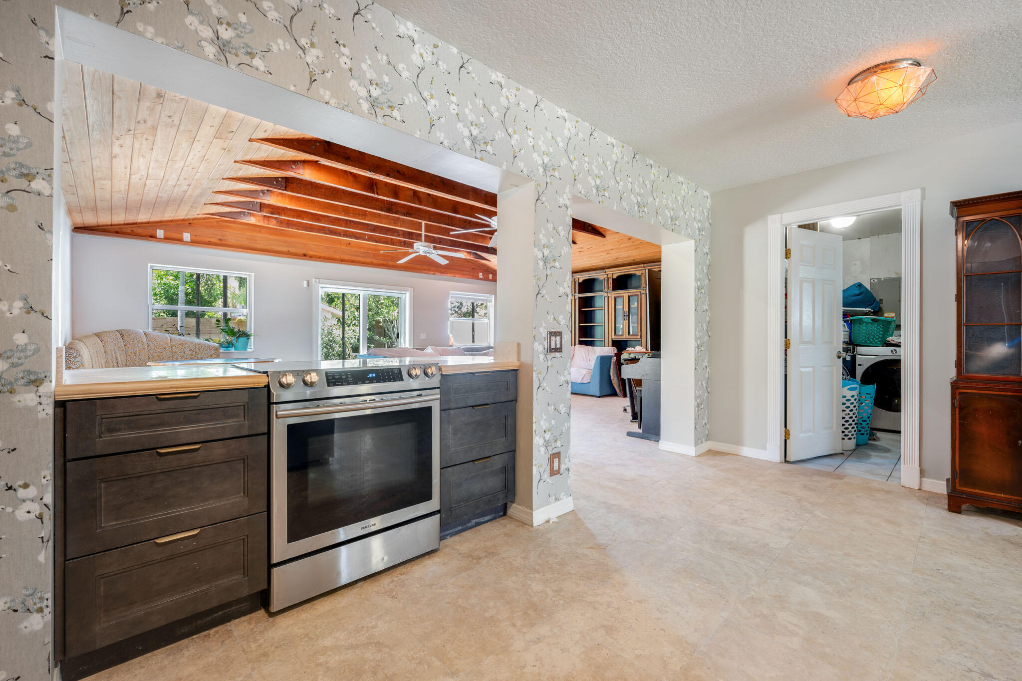 1216 Neoga Street Jupiter, FL 33458 - Photo 8 of 27 a kitchen with stainless steel appliances a stove and a refrigerator