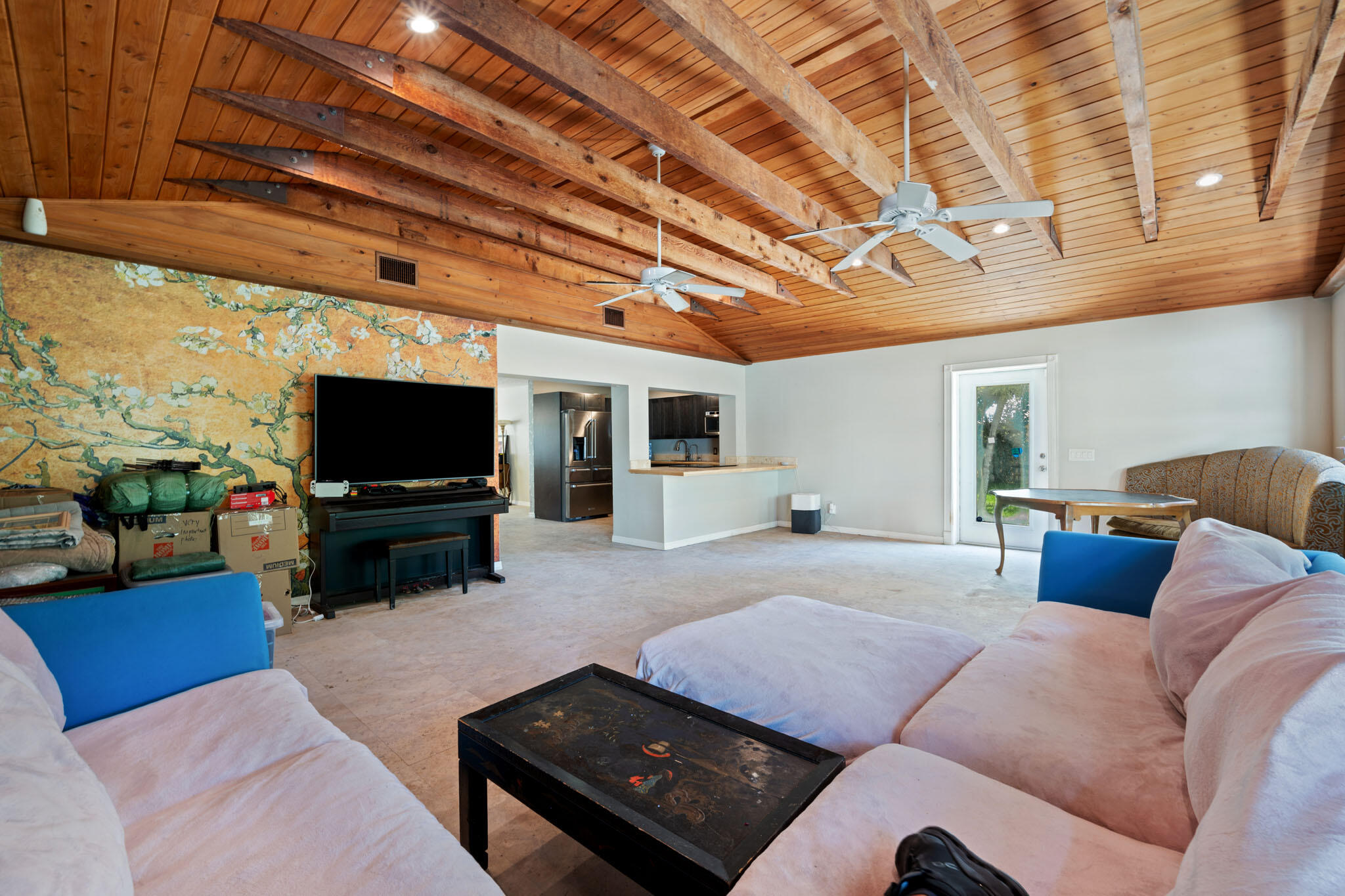 1216 Neoga Street Jupiter, FL 33458 - Photo 10 of 27 a living room with furniture and a flat screen tv