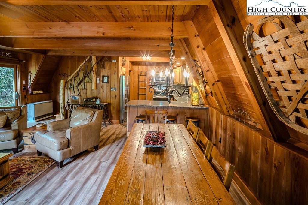 268 Cherry Drive Boone, NC 28607 - Photo 23 of 33 a view of a balcony with chairs and wooden floor
