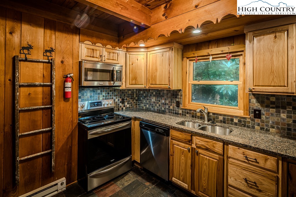 268 Cherry Drive Boone, NC 28607 - Photo 25 of 33 a kitchen that has a sink and a stove