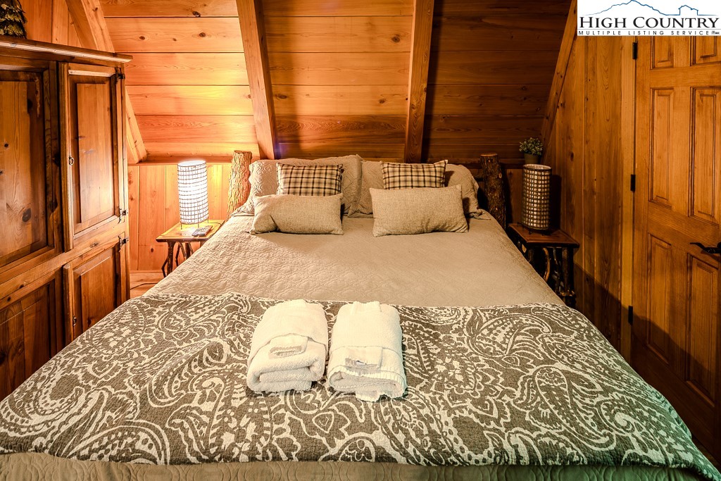 268 Cherry Drive Boone, NC 28607 - Photo 26 of 33 a bed sitting in a bedroom next to a window